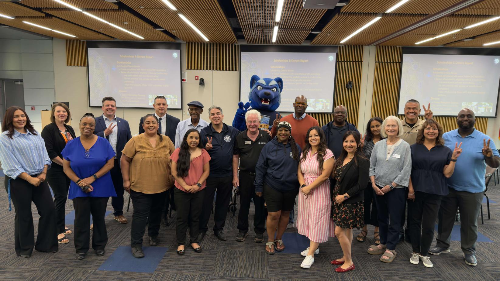 The SBVC Foundation Board poses with Blue the Wolverine