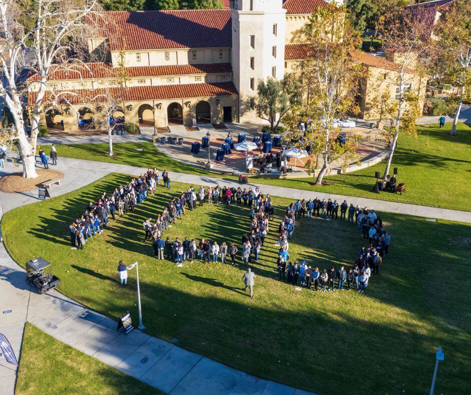 A drone shot of SBVC faculty and staff standing and forming a 100 for SBVC's Centennial